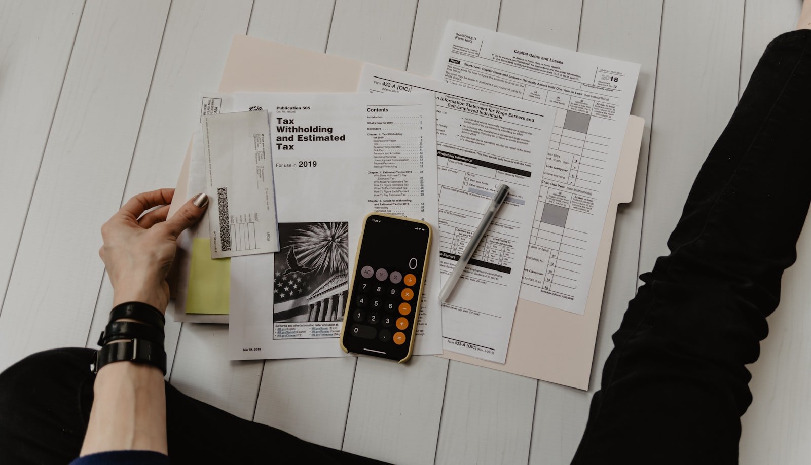 Calculator, notebook, and budgeting setup
