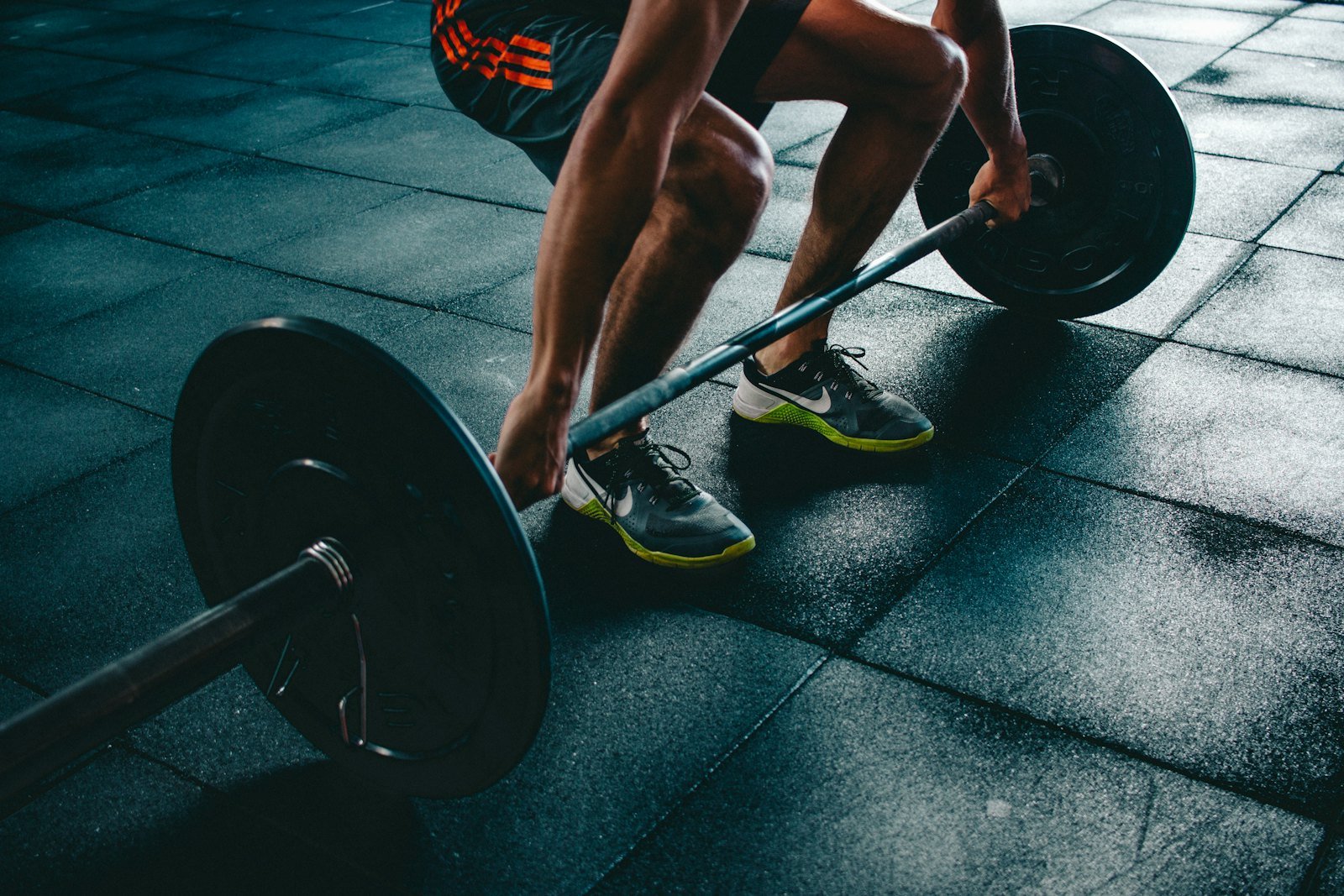 A simple home workout setup with dumbbells and a mat