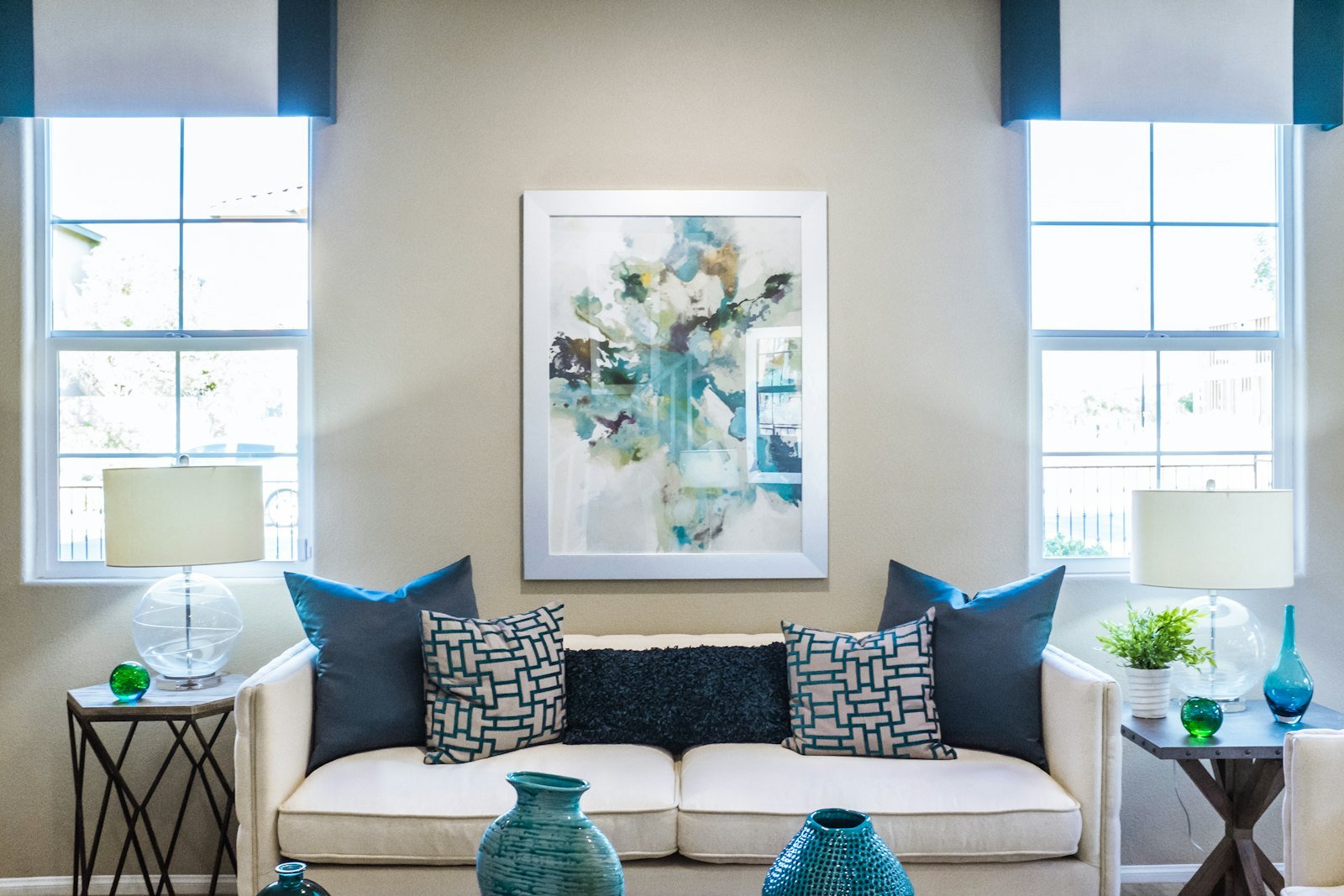Furnished living room with clean seating, soft lighting, and a “finally off work” feeling